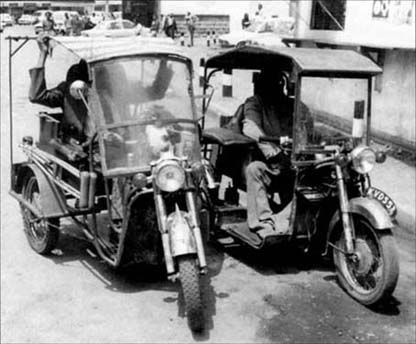 © Photo of three-wheeled motorcycles that have been modified for use by persons with mobility difficulties