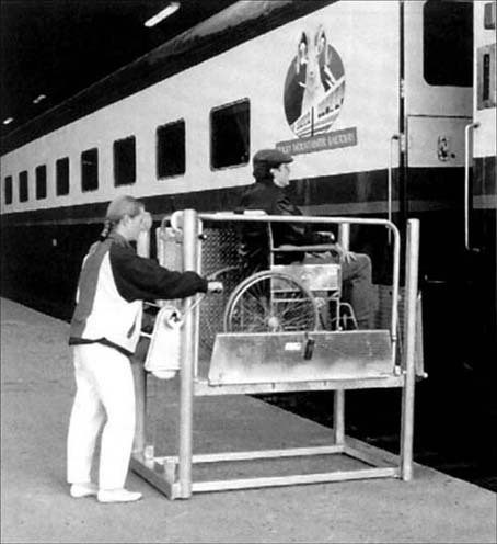 © Photo of a portable hand-operated lift to provide access to train from platforms
